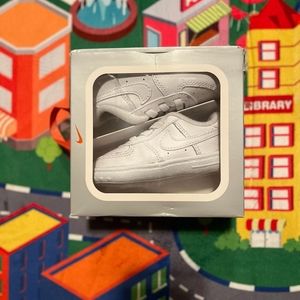 Nike infant shoes size 4 in the color white.